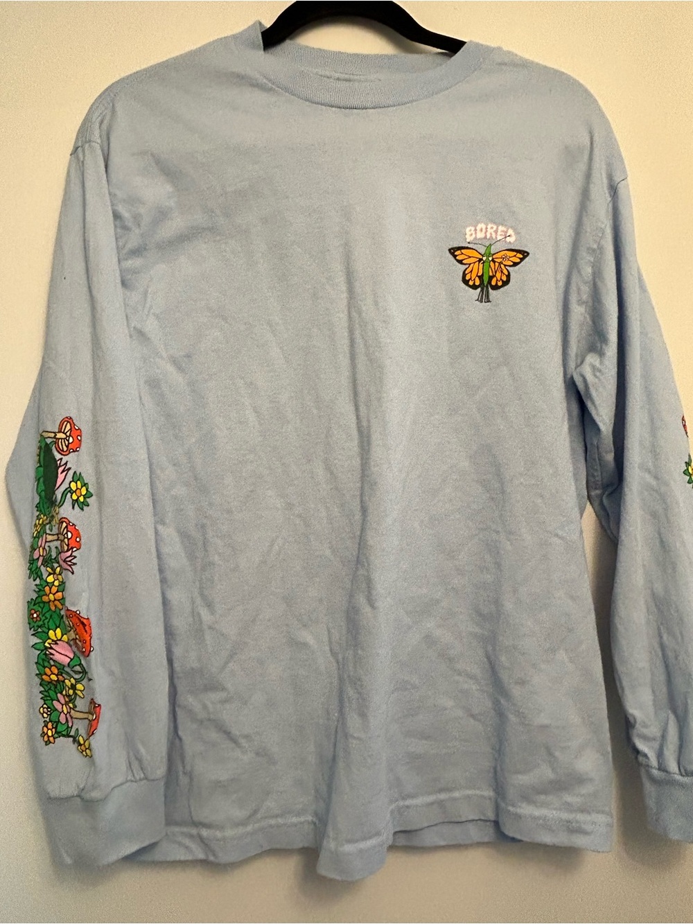 Bored Teenager Blue Long-Sleeve Graphic Tee with Butterfly and Sleeve Art